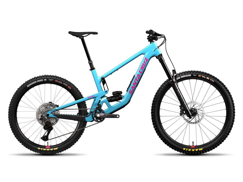 SANTA CRUZ 2027 Nomad Deore · Gloss Aqua Magenta (Nomad 2027) · Nomad Deore · vista lateral